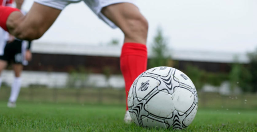 kicking a soccer ball
